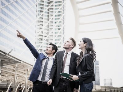image-business-partners-discussing-documents-ideas-meeting-together-outside